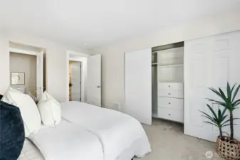 Enormous closet fits even more with built-in closet organizers.