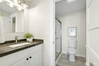 Two separate bath vanities, one attached to the primary bedroom.