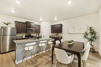Stainless steel appliances in the open kitchen
