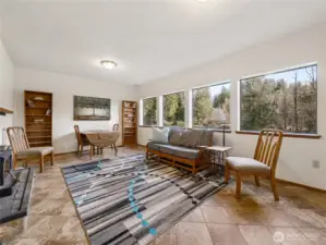 Once downstairs, this very comfortable room with endless views offers opportunities to exercise, play games, or watch a movie.