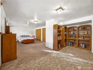 This extremely large room has a bed, but we thought it would be an awesome office/library, crafting/sewing/hobby space! It has two large closets and it's own outside entry.
