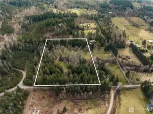 This view faces to the south (north is at the bottom of the picture). The house is at the center of the lower part of the property. See the picture with lot lines for more clarity.