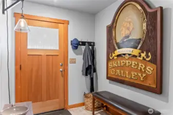 The generous entry hall has plenty of room for a shoe bench and coats