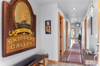 The entry leads to the light filled great room beyond.