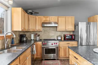 The 'leathered' granite counters, tiled backsplash and high-end appliances are a cook's dream.