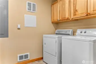 The laundry/utility room has lots of storage space.