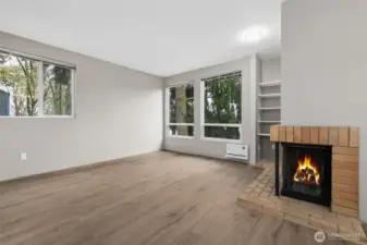 The wood burning fireplace and built in shelving are lovely focal points!