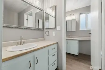 The full bath includes a private space off the bedroom for owner use that features a sink and tub. The remaining part is a sink, toilet,  washer  and dryer.