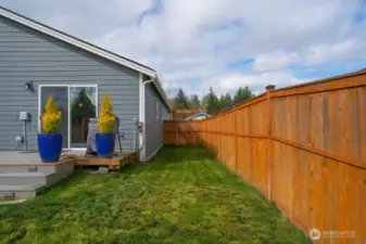 Drip irrigation lines into Blue Pots on Deck