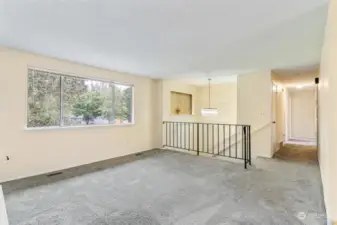 Hallway leads to 3 bedrooms and 1 shared full bathroom