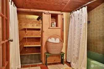 Washer & Dryer are behind the curtains to your left. Straight ahead is the walk in closet/pantry/storage area. There is a baseboard heater in the bathroom.