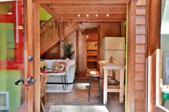 You have just stepped inside. The warmth of the wood finishes and the efficient use of space greet you at the front door. Immediately to your left is the fully finished porch that previous owners enclosed.