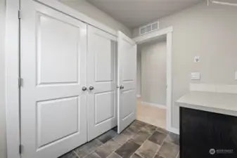 Spacious laundry room with storage