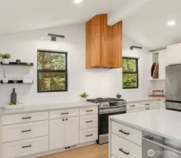 Updated, bright kitchen with oversized island for entertaining or eating.