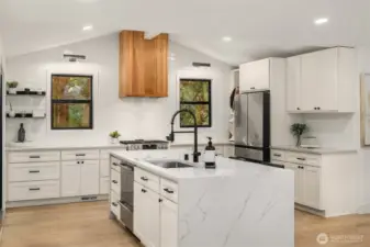 Updated, bright kitchen with oversized island for entertaining or eating.