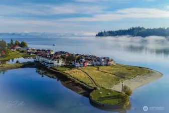 The Inn at Port Ludlow is public as are the sandy beaches. In the left-hand background looms Mt. Baker.
