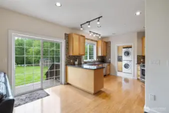 Eating area to kitchen with slider to back deck area