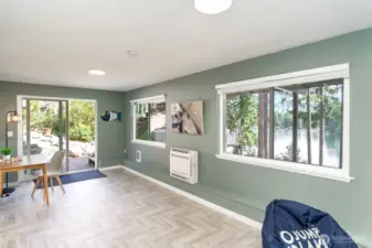 Other end of bonus room with slider to the hot tub and backyard
