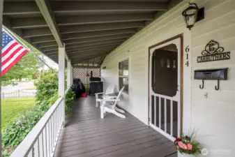 See the charm of the early 1900 farm houses in this full front porch.