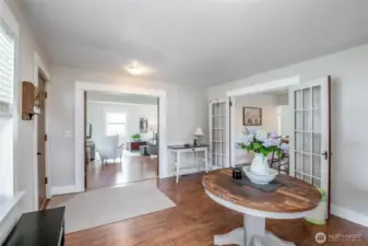 Enter the kitchen and living room through two sets of french doors.