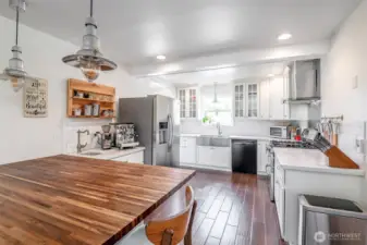 Like the rest of this home, the remodeled gourmet kitchen provides ample space for meal prep work or baking and has a large eating area.
