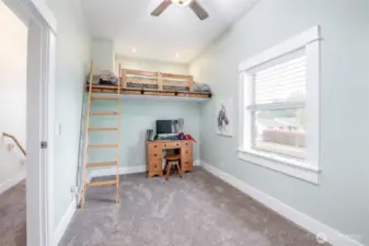 Across from the primary is another bedroom or play area.
