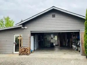 Oversized 2 car garage with a shop and storage space.