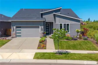 Beautiful street appeal welcomes you into this 2021 built home offering a true guest suite! In addition to the bedroom, there is a private sitting room with a kitchenette,  en-suite bath and walk-in closet w/ built ins.  Not to mention it is adjacent to a permanent berm offering utmost privacy and scenic views!