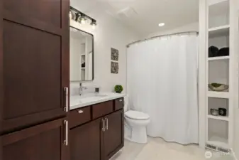 Large full bathroom in the hallway between the two bedrooms. Newer upgrades plus new paint and lighting. Tons of storage space!