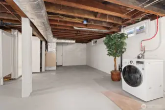 Another view of the sizable basement. The washer and dryer can be moved upstairs off the garage for true one-level living.