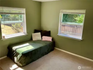 bedroom 2 has double window and a corner facing back yard