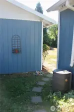 Into the backyard between the house and garage