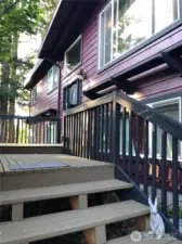 Roomy front porch is private due to lovely maple