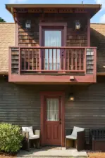 Side door entry to laundry area. Private Balcony above.