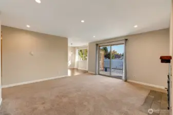 Well lit living room with recessed lighting gives a modern, open feel.
