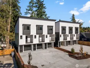 One of 2 triplex.Extra long driveways for additional parking spaces plus a deep one car garage.