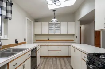 Beautiful bright kitchen with plenty of cabinet space.