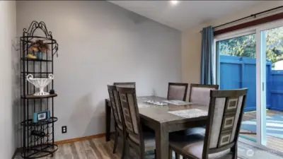 Dining area leading to outdoor entertainment space.