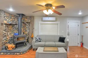 River rock fireplace.  Above window is the Mini split system for additional heat/AC