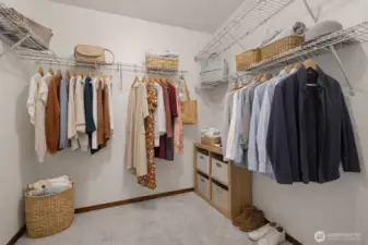 Virtually staged primary walk in closet
