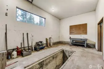 2nd bay in detached shop with maintenance pit.