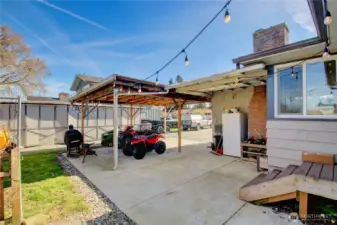 Door off kitchen onto patio, carport and storage