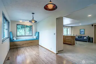 The  bonus room and kitchen.
