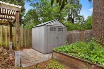 Lower level of back yard has a covered area, shed and room to use as you wish.