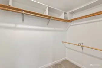 Walk in closet to primary bedroom.