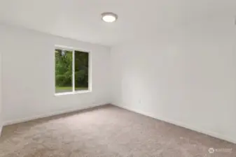 Second bedroom, with fresh paint and new carpet.