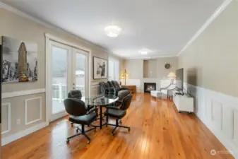 This family room features a gas fireplace for those winter nights ahead. French doors open to a beautiful deck. Sit and enjoy morning coffee.