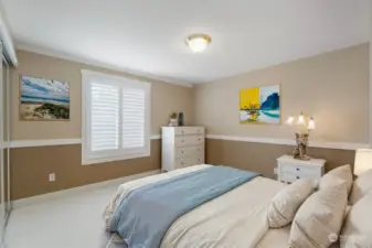 Guest bedroom located on second floor is full of natural light.