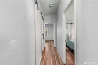 The sellers added barn doors on the guest bathroom and primary bathroom entrances. Made for a better flow and a lot of class!