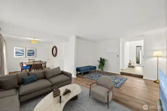 living and dining area with views overlooking the deck and lush greenery—bringing the outdoors in